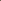A woman reclining indoors wearing a ribbed light blue sleeveless wrap-style dress with a deep V-neck and high side slit. The setting appears to be a modern bedroom or lounge area with shelves, curtains, and a teddy bear on a table.